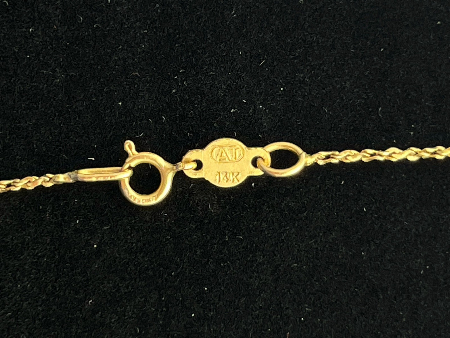 14k yellow gold rope  20 in chain  1 mm   weighs 2 g  marked AT in a circle