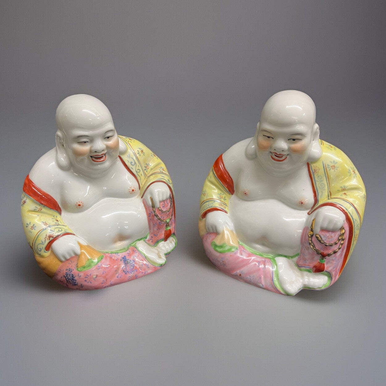 PAIR OF CHINESE FAMILLE ROSE PORCELAIN FIGURES OF SEATED BUDAI BUDDAH